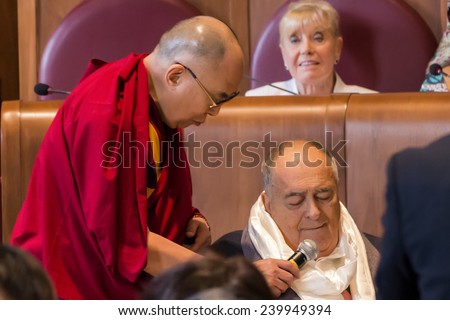 Rome, Italy - December 14, 2014: The Dalai Lama presented the Peace Summit Award to Italian film director Bernardo Bertolucci.