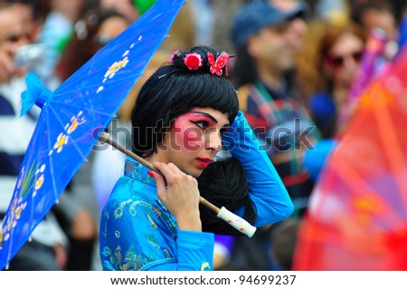 LIMASSOL, CYPRUS - MARCH 6: Participant from Chinese Theme Group  marches during the annual Grand Carnival Parade on March 6, 2011 in Limassol, Cyprus.