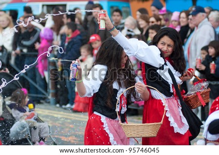 LIMASSOL, CYPRUS - FEBRUARY 18: Unidentified Carnival participants dressed like a red riding hoods during Children\'s Carnival Parade on February 18, 2012 in Limassol, Cyprus.