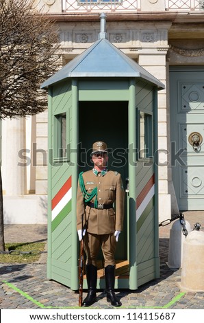 BUDAPEST-MARCH 26: Hungarian guard stood at check-post in front of palace gate at 26 March 2012 in Budapest, Hungary. This Palace has been UNESCO World Heritage site since 2002.