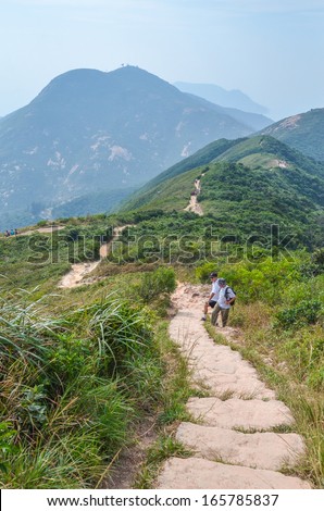 HONG KONG - OCTOBER 19 : Trekker are trekking on Dragon Back trail in Hong Kong on October 19, 2013. Dragon back trail in one of the most famous trekking trail in Hong Kong
