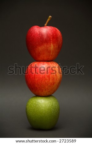 A stack of apples, with one odd one out.