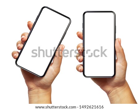 Woman hand holding the black smartphone with blank screen and modern frameless design two positions angled and vertical - isolated on white background 商業照片 © 
