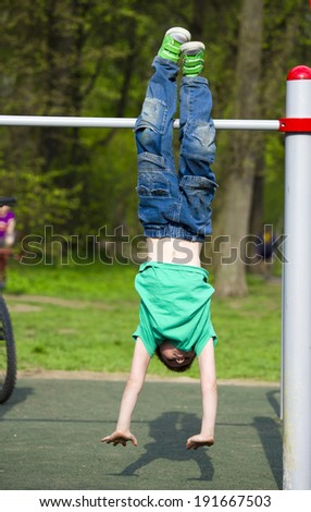 little boy engaged in athletics for sports equipment
