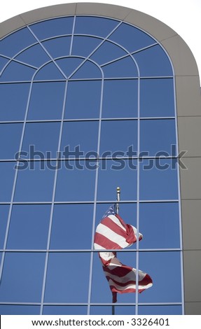 A reflection of an American flag in the windows