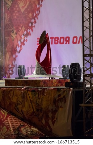 Novosibirsk, Russia - December 7, 2013 :Bowl Olympic flame at the Olympic torch relay in Novosibirsk
