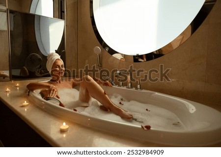 Similar – Image, Stock Photo Caucasian lady floating in turquoise sea.
