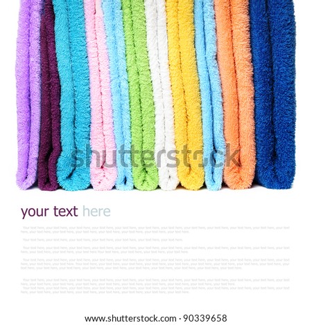 Pile of linen kitchen towels on a white background (with sample text)