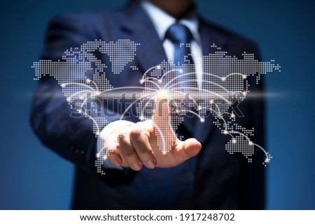 Businessman touch point of city connection line in world map. Man press button on virtual screen of planet earth show start up, business plan, communicate, technology, global network, internet concept Foto d'archivio © 