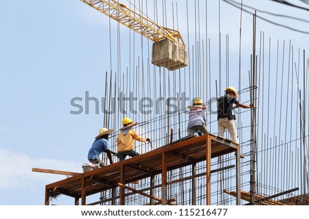 Construction site with crane and workers