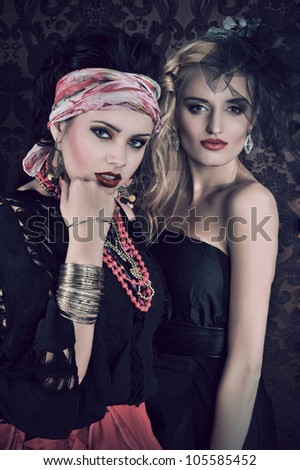 Portrait of gorgeous gypsy woman with another women