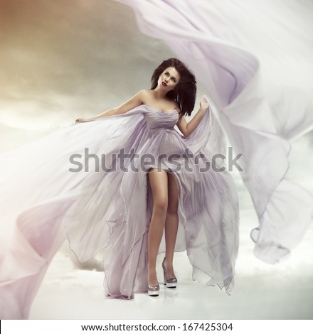 Portrait of a beautiful sexy young woman in violet dress