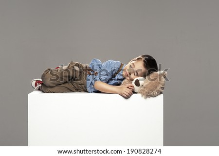 small boy sleep with bear