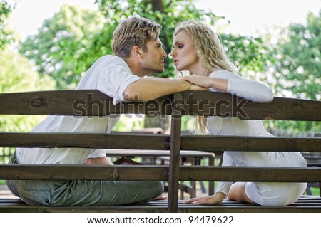 Kissing couple on the bench