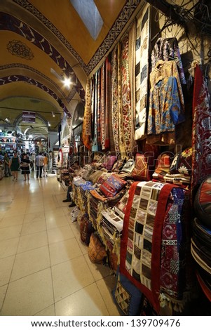 ISTANBUL, TURKEY- MAY 24: People and tourists visit and shopping in Grand bazaar on May 24, 2013. Grand Bazaar is in Fatih district of Istanbul, Turkey. It is Asian style market and attracts visitors.