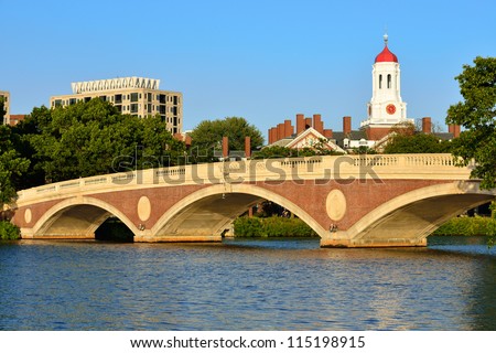 John Weeks Memorial Footbridge over the Charles River, Cambridge. White tower and red dome of Harvard University\'s student residence in the back.
