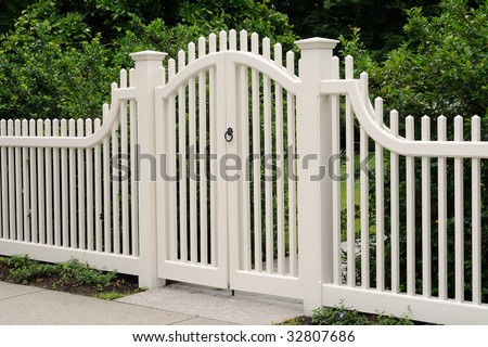 Elegant wooden gate and fence on house entrance