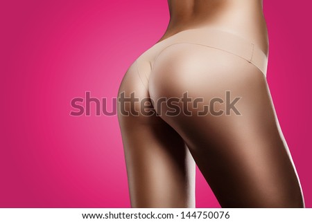 Horizontal Photo Of A Perfect Body On Black Background. Special Care And Attention For The Skin Retouching. Lila Background.