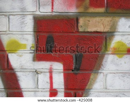 Detail of a graffiti on a bricks wall