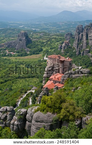 The Holy Monastery of Rousanou is the part of the Meteora complex ( Greek Orthodox monasteries, Greece). The building is situated on the top of rock and is surrounded with mountains and green forest.