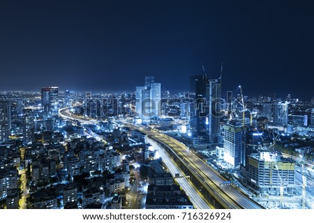 Tel Aviv Skyline At Night, Skyscraper and Ayalon Freeway - Toned In Blue Stock fotó © 