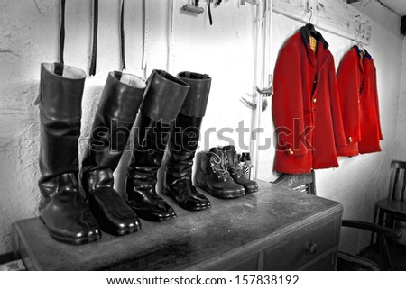 Hunting jackets hanging & polished boots