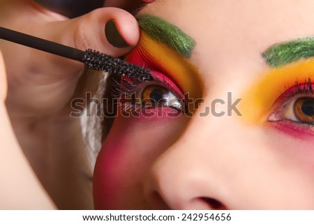 Beautiful Woman Having Colorful Makeup Put On Her Face