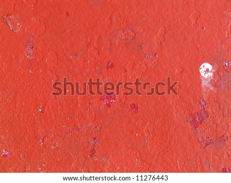 red paint on metal surface