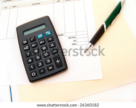 calculator with pen and invoice