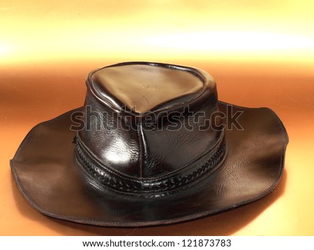 a brown leather hat