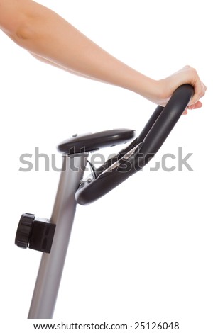 Woman hands on a bar stationary bike isolated on white