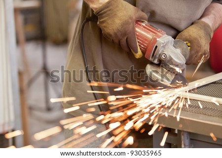 grinding the head of screws making sparks