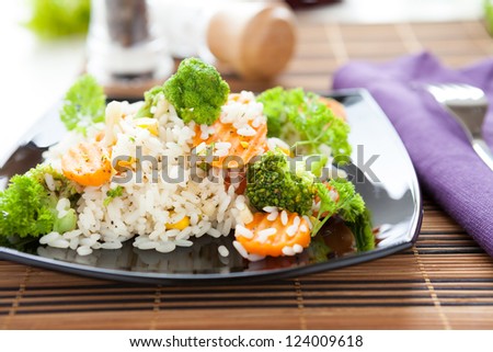 vegetable risotto on a square plate, horizontal composition