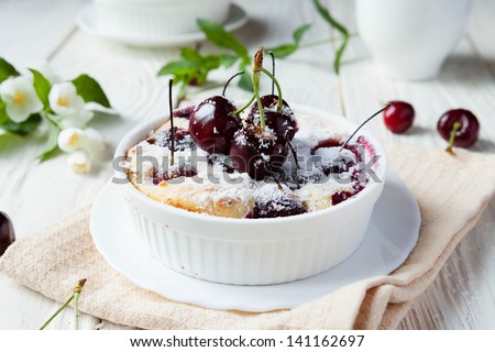 Cherry Clafoutis with powdered sugar, food close up