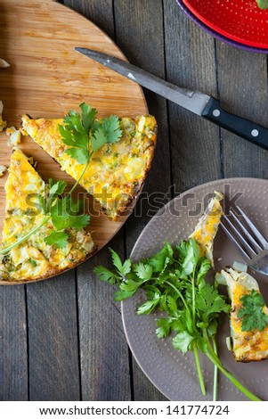Spanish tortilla with vegetables and greens, food