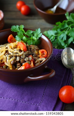 appetizing and healthy lentils with vegetables, food closeup