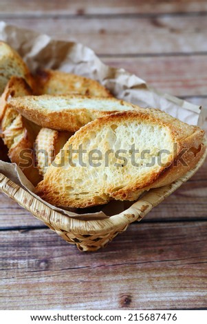 Pieces of toasted  bread in a basket, food close-up
