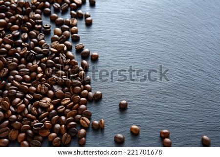 Coffee beans on a slate background, roasted grain