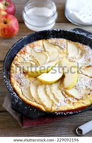 Delicious pie with pears in a frying pan, closeup