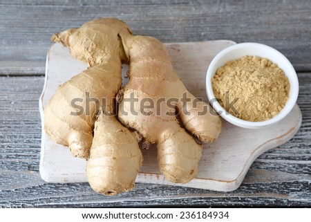 Ginger root and ginger powder in a bowl, spicy
