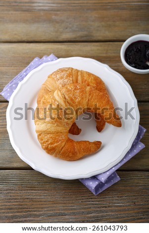 French croissant and jam, food closeup