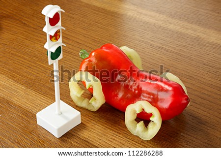 Health concept. Traffic light and car from pepper
