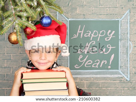 Christmas decoration, schoolboy and message on chalkboard \