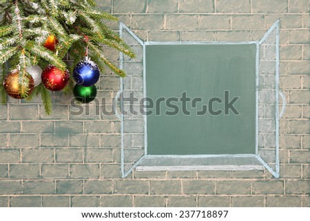 Books and Christmas decorations before blackboard with blank space for your text