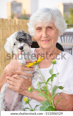 Senior happy woman and dog