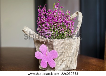 beautiful pink  flower with gift card packed in canvas bag