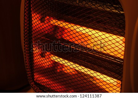 side view electric heater working in dark space