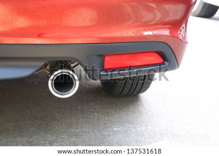 exhaust pipe of a red car close up