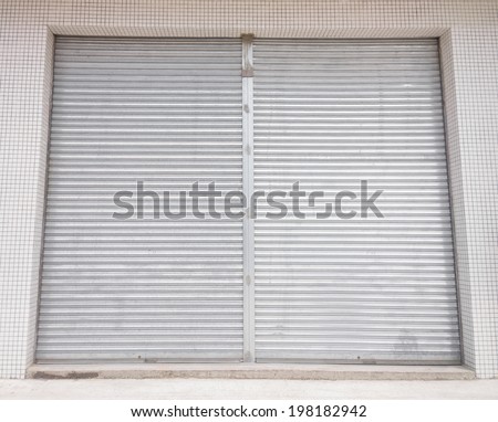 blank metal shutter doors on commercial shop front