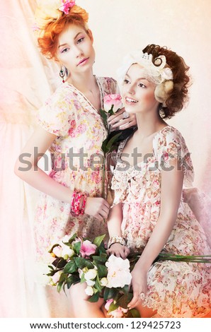 Freshness. Two Young Pretty Women in Classic Vintage Dresses with Flowers. Pin-up Style
